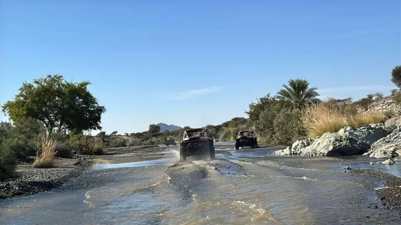 Following the guide through an Omani water crossing