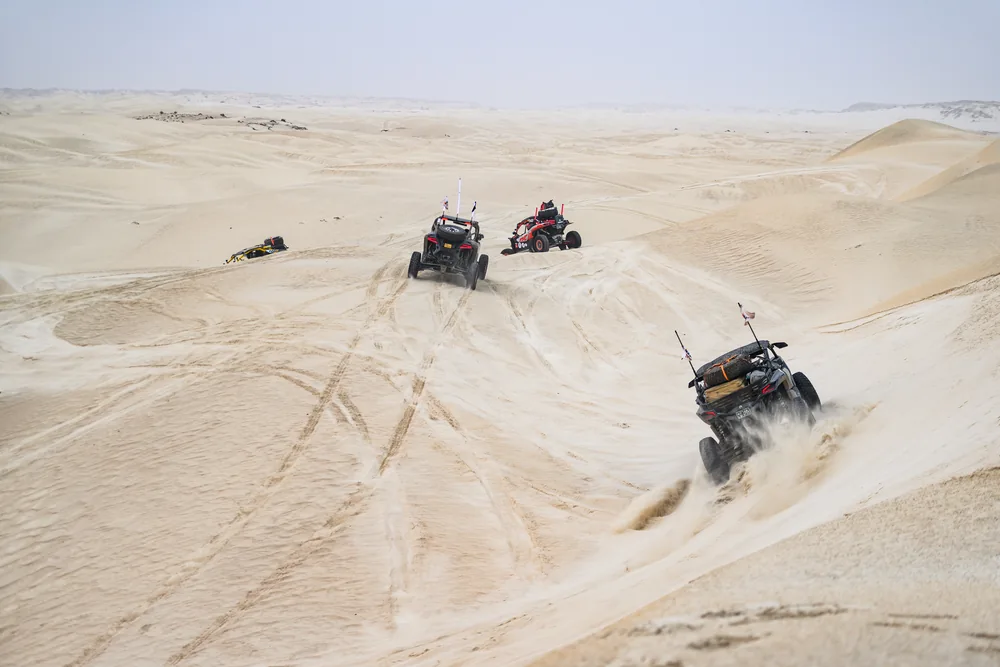 A FOX ATVs convoy finding its way through the dunes