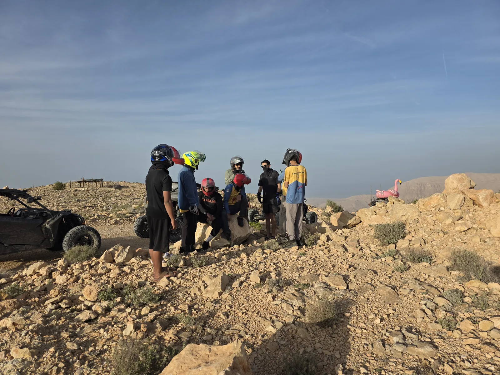 FOX ATVS participants pausing at a rocky mountain viewpoint
