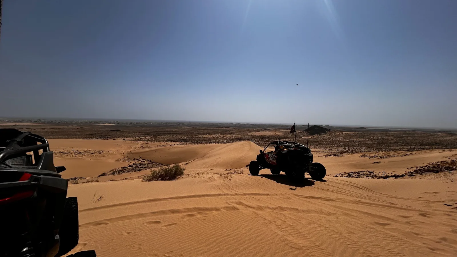 FOX ATVs buggy travelling through open sandy terrain in Oman