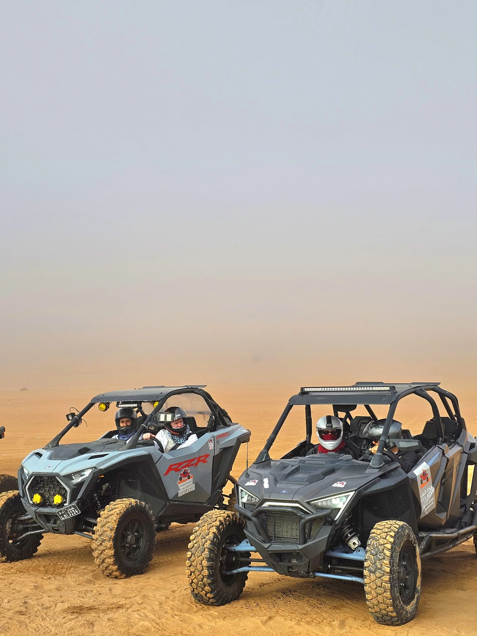 Guests sharing a buggy adventure in the desert