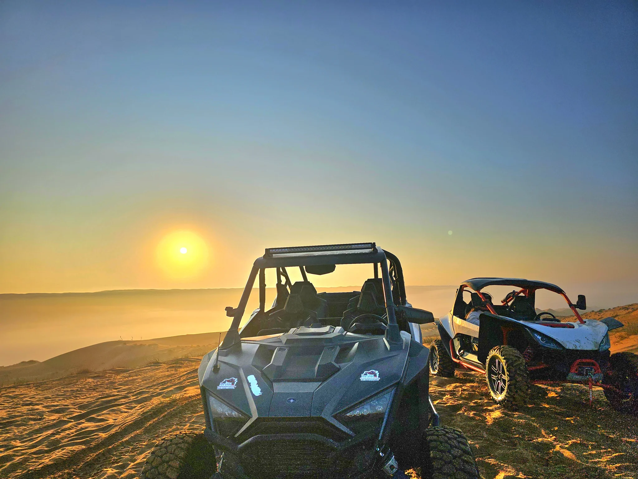 Two FOXATVs buggies in warm morning light on the dunes
