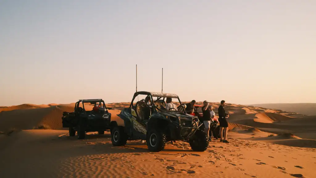 FOXATVs buggies and guests on the dunes at sunset in Sharqiya Sands