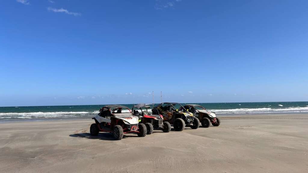 Four FOXATVs off-road buggies beside the Arabian Sea in Oman